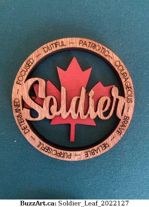 Dual layer Soldier ornament with the Canadian flag in the back ground